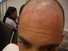 Man's bald head with some writings